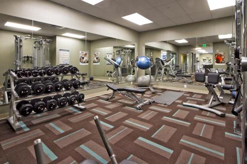a fitness room with a gym with weights at OUTRIGGER Honua Kai Resort and Spa in Lahaina