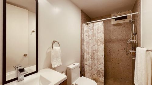 a bathroom with a toilet and a sink and a shower at Ocean View Retreat with Pool and Jacuzzi in Tijuana