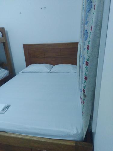 מיטה או מיטות בחדר ב-Coveñas Mary plaza