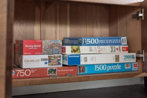 a stack of books sitting on a shelf at Perfect for Groups or Families in Prospect in Kings Meadows