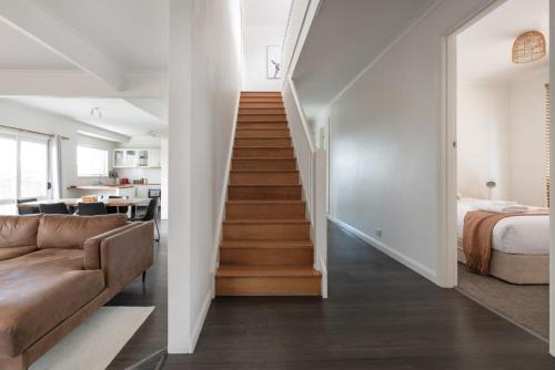 a staircase leading up to a bedroom in a house at Perfect for Groups or Families in Prospect in Kings Meadows