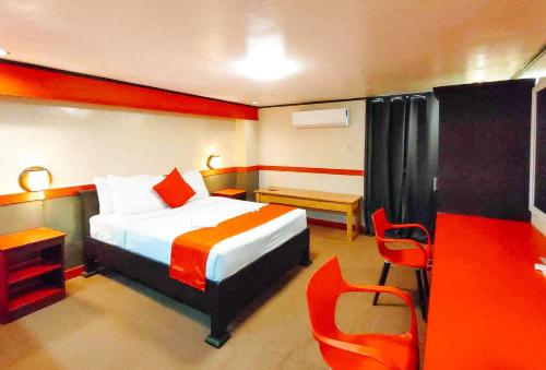 Postel nebo postele na pokoji v ubytování RedDoorz @ Hotel Dian Aparri