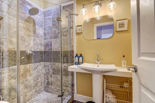 a bathroom with a sink and a shower at Lovely 2-Bedroom Unit in Springfield in Springfield