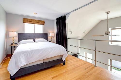 a bedroom with a large bed and a window at Stunning 2 Floor Penthouse Downtown in Chicago