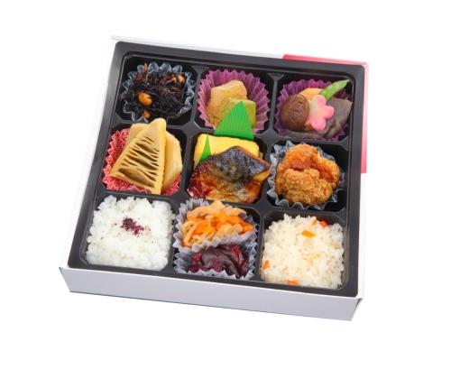 a plastic container filled with sushi and rice at RESI STAY Jisco Hotel Kyoto Goshonishi in Kyoto