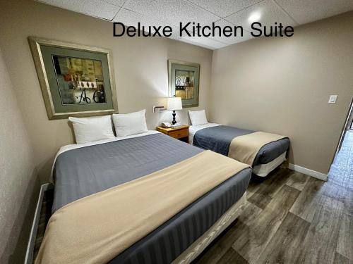 Ένα ή περισσότερα κρεβάτια σε δωμάτιο στο West Coast Motel on the Harbour