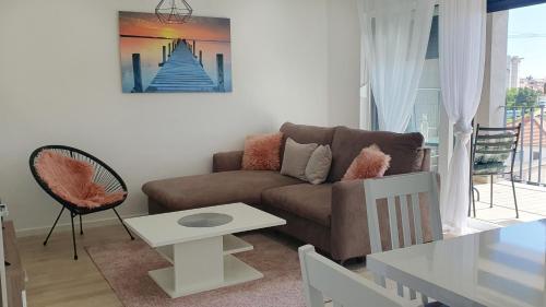 a living room with a couch and a table at Apartment Dino, Zadar in Zadar