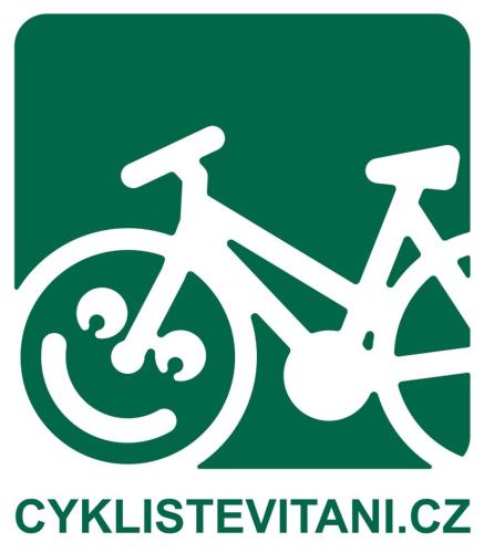a white bike logo on a green background at Paseky Apartments Resort in Nové Město na Moravě