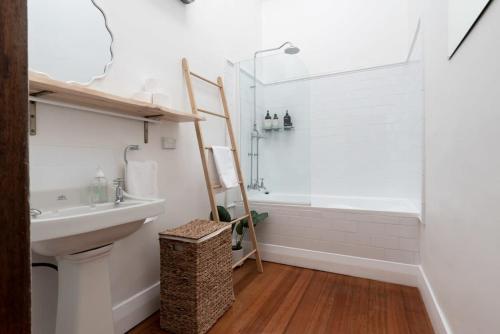 a bathroom with a shower and a sink at Ohio House in Launceston