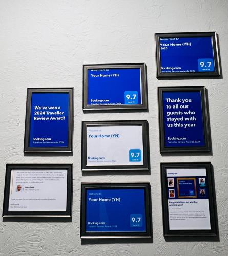 a group of framed screens on a wall at Your Home (YH) in Yerevan