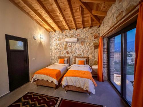En eller flere senge i et værelse på Villa İkizler 1