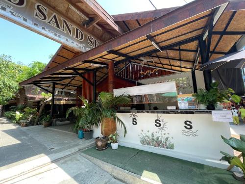 a restaurant with a counter with plants on it at Samed sand sea resort in Ko Samed