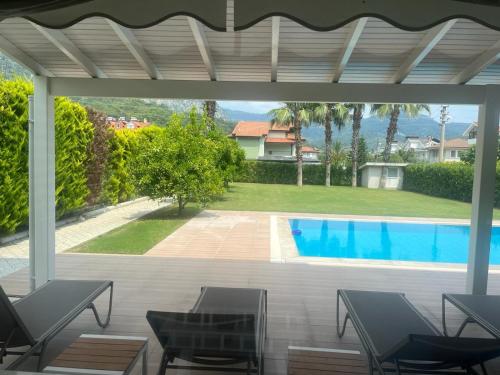 a view of a swimming pool from a patio at blue depth villa in Fethiye