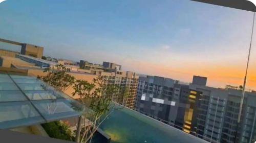 a view of a building with a swimming pool at Camelia Youth City Nilai Studio residence 5pax in Nilai