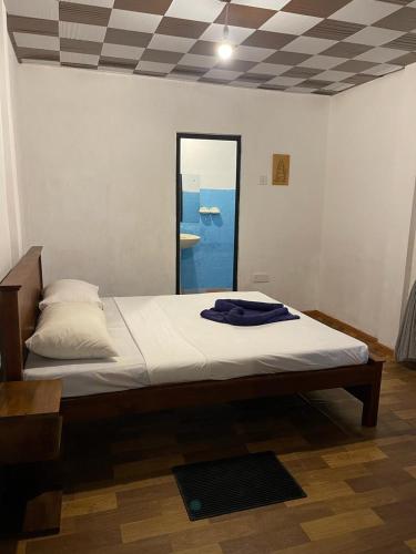 Postel nebo postele na pokoji v ubytování Coconut Bar