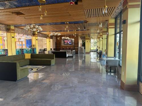 a lobby with couches and chairs in a building at THE GOLFERS INN in Upper Darby