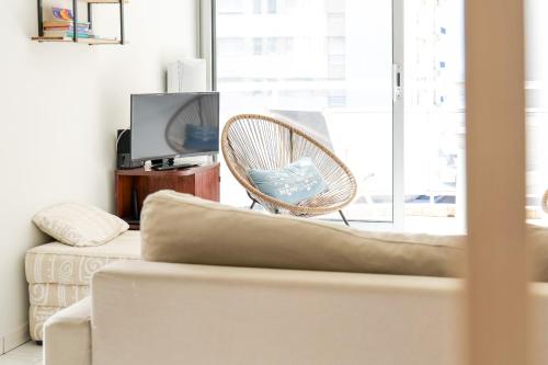 TV a/nebo společenská místnost v ubytování Joli appartement idéalement situé à deux pas de la Grande plage - 4 pers