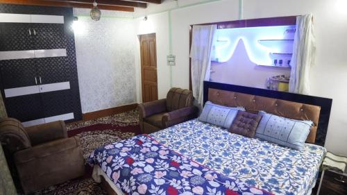 Postel nebo postele na pokoji v ubytování WANI GUEST HOUSE