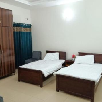 Cama o camas de una habitación en Capital Guest House, Islamabad near Bahria Town , Rawalpindi
