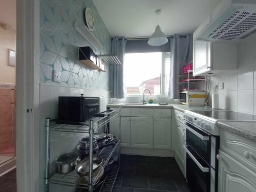 a kitchen with a sink and a stove top oven at yeolde country View seashak Cottage NOV SPECIALS FREE electric LOW PRICES ENJOY BRING YOUR DOG in Bridlington