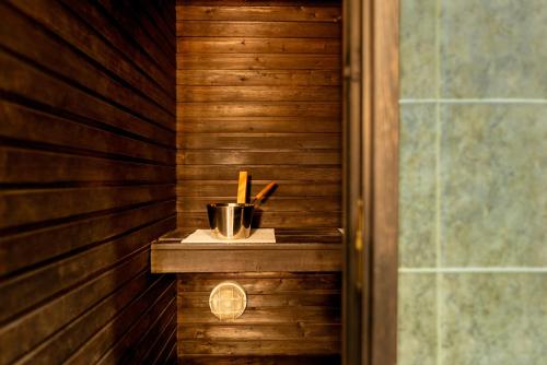 a corner of a sauna with a cup on a counter at Metropol Hotel in Tallinn