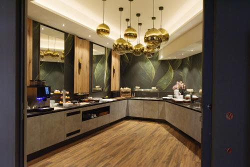 Η κουζίνα ή μικρή κουζίνα στο Hotel Demas München-Unterhaching