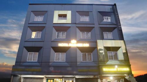 a building with a light on the front of it at Voyage Comfort Primer Inn in Siliguri