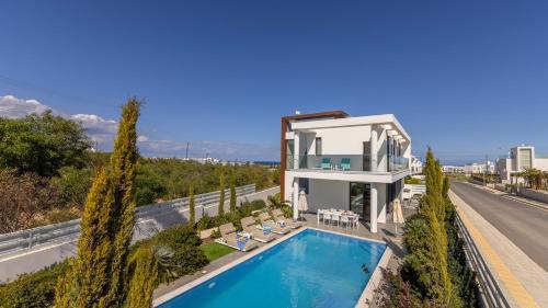an aerial view of a house with a swimming pool at Diamond villas in Protaras