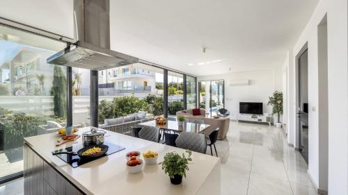 an open kitchen and living room in a house at Diamond villas in Protaras