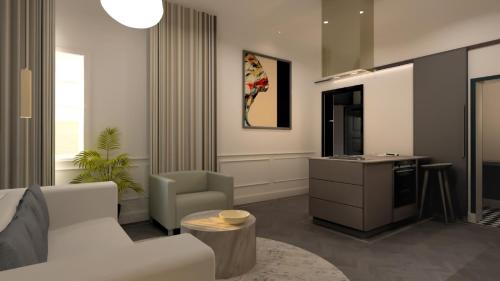 a living room with a white couch and a table at Bridge Steet Apartments in Morpeth