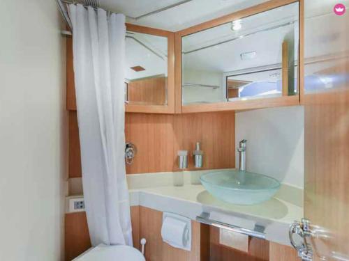 a bathroom with a sink and a toilet at Luxury 2 Bed Boat With Crew in Ban Laem Hin
