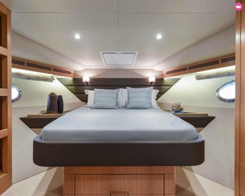 a bed in a small room in a boat at Luxury 2 Bed Boat With Crew in Ban Laem Hin