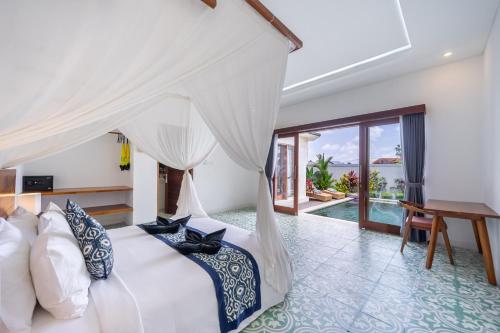 a bedroom with a bed and a view of the ocean at Stylish villa, Ubud, 2 bed,2 bath, central location, pool, private! in Ubud