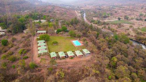 an aerial view of a house with a swimming pool at Nature Trails Durshet, Khopoli in Khopoli