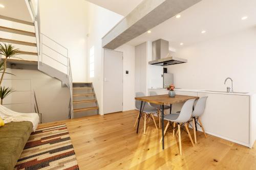 a kitchen and dining room with a table and chairs at Dash Living Kagurazaka in Tokyo