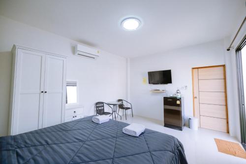 Ένα ή περισσότερα κρεβάτια σε δωμάτιο στο Peeranon Resort
