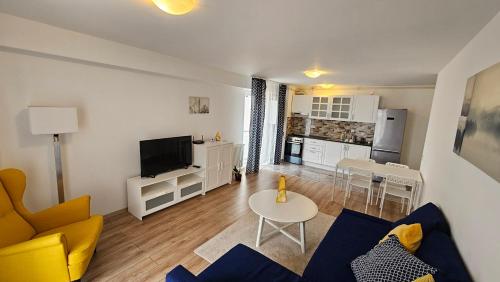 a living room with a couch and a table at Airport Residence in Otopeni