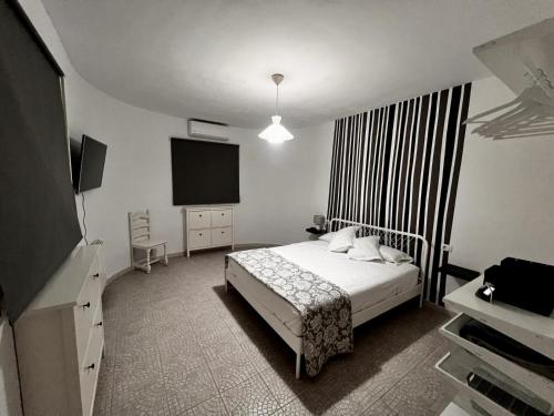 Villa Gairía tesisinde bir odada yatak veya yataklar