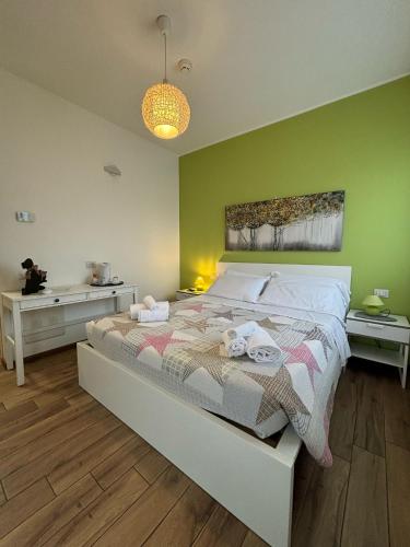 Postel nebo postele na pokoji v ubytování Airuno Rooms
