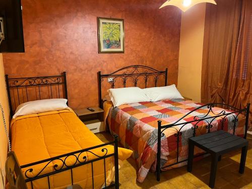 a bedroom with two beds in a room at Le Ganze in Ceprano