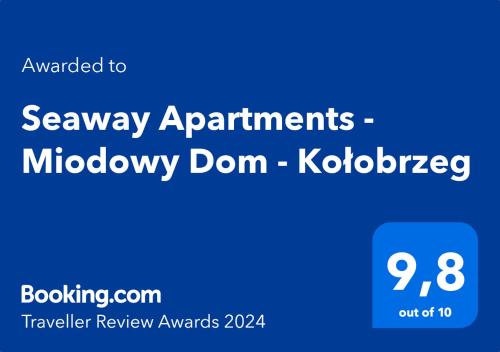 a blue sign with the wordsasonay appointmentsumbledore dome kobiotechnology at Seaway Apartments - Miodowy Dom - Kołobrzeg in Kołobrzeg
