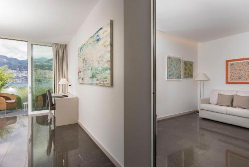 a living room with a couch and a table at Bellevue San Lorenzo (Adults Only) in Malcesine