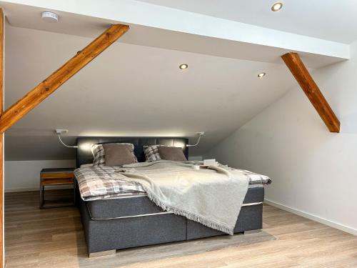 a bedroom with a bed in a attic at Lottmaringhausen in Meschede