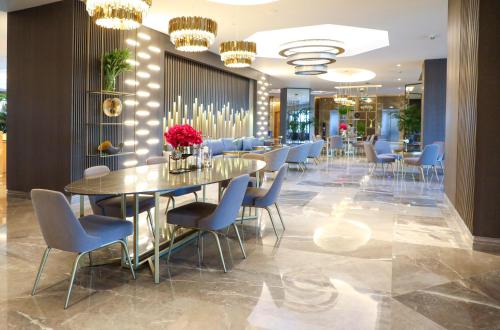 a dining room with a table and chairs at Miramare Beach Hotel - Ultra All Inclusive in Side
