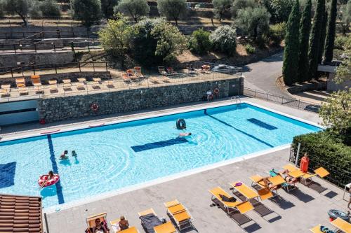 an overhead view of a swimming pool with people in it at Camping Brione in Riva del Garda