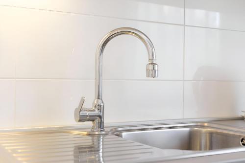 a kitchen sink with a silver faucet at NEW! Apartments with shared pool, Vodice in Vodice