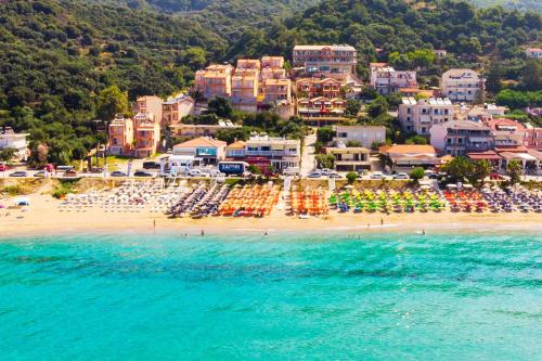 an aerial view of a beach with chairs and umbrellas at Ermioni Rooms in Paralia Vrachou