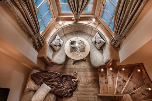 an overhead view of a spiral staircase in a building at Sporthotel Romantic Plaza in Madonna di Campiglio
