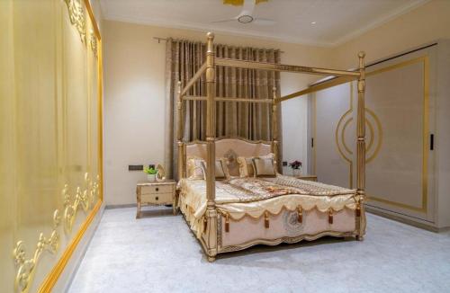 a bedroom with a canopy bed in a room at Redhomex Cove Castle Villa in Hyderabad