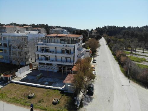 an aerial view of a building next to a road at Ammos Hotel in Agia Triada